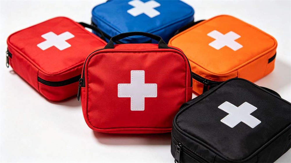 First aid kit multi color red blue orange black with medical cross symbol emergency medical supplies