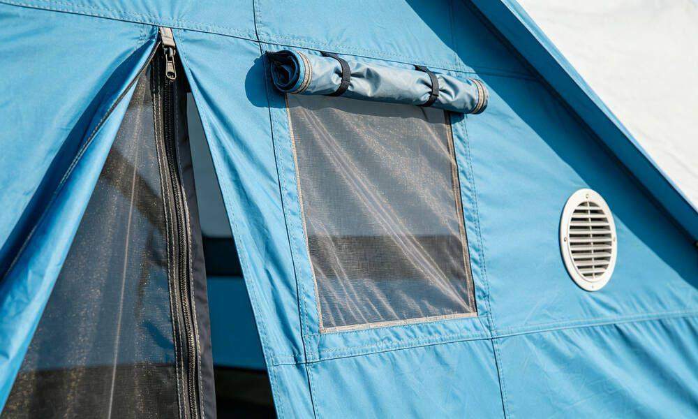 Emergency tent entrance door with zipper, roll-up window with mosquito netting and ventilation vent