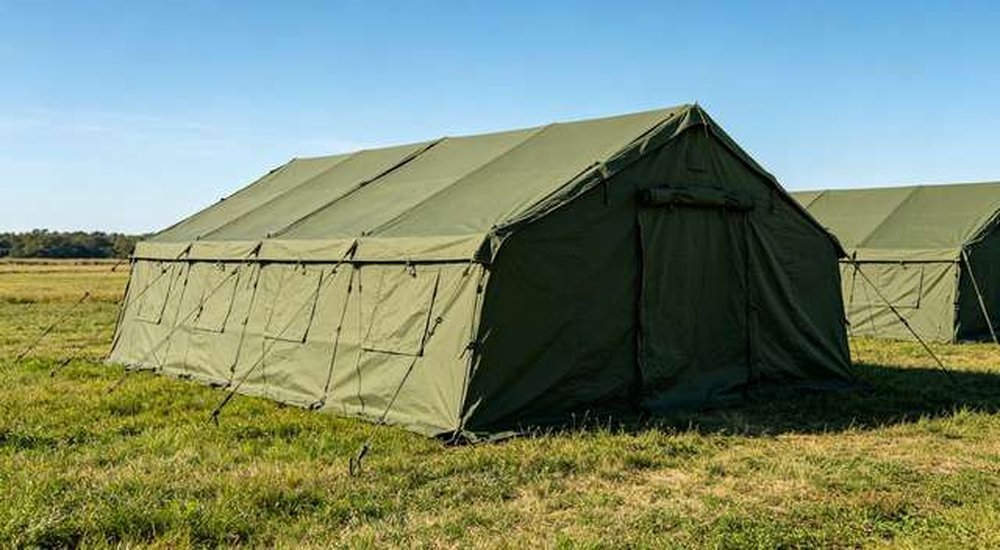 Military green emergency tent in grassy field operation area, no people no weapons, custom OEM tactical shelters, professional product photography